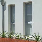 Large image of aluminium bi-fold doors opening into living room