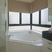 Awning windows near bathtub in the bathroom