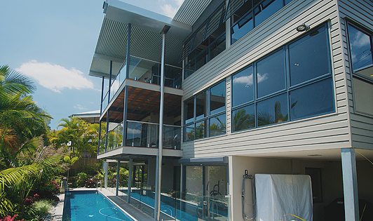 Outside view of a duplex house with tinted aluminium awning windows