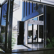 Tinted aluminium bi fold doors at the entrance of a house