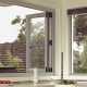 Open white frame aluminium bi-fold windows in a kitchen