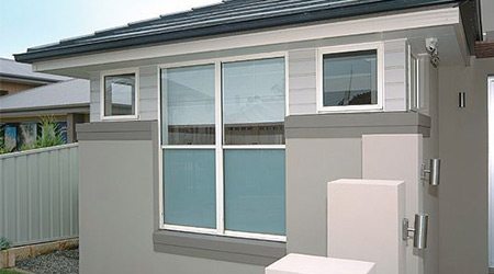 white house with double hung windows External view of house with double hung windows