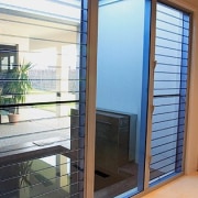 Room with tinted louvre windows