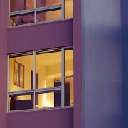 Outside view of purple apartment building using aluminium windows