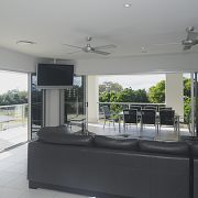 Living room stacker doors opening into balcony area