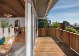 Angular view of timber balcony opening into living space