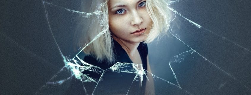 broken window, anxious woman